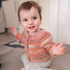 

Coral - Children’s Cardigan
2
