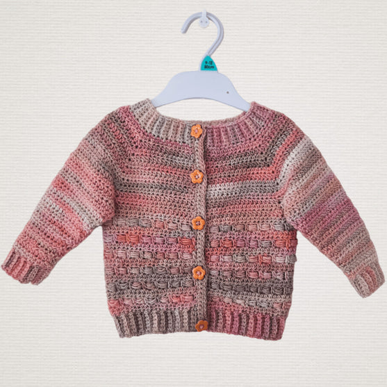 

Coral - Children’s Cardigan
4