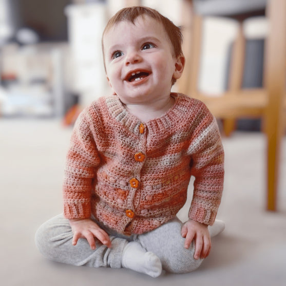 

Coral - Children’s Cardigan
1